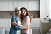 Mother and daughter hugging