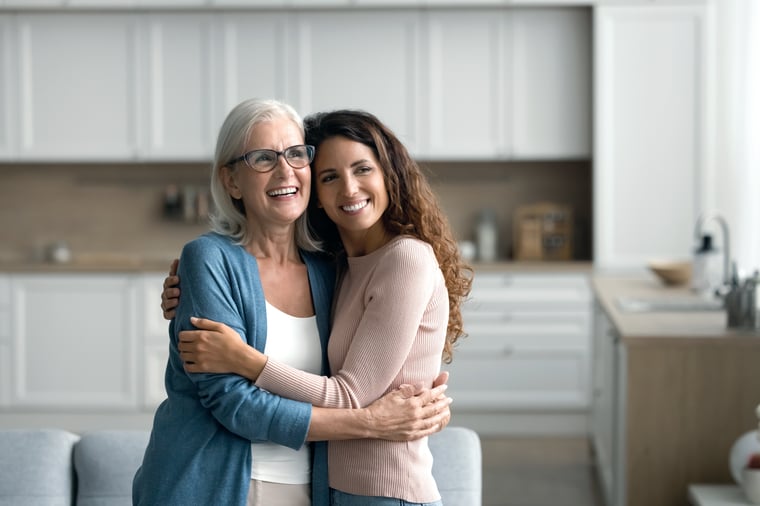 Mother and daughter hugging