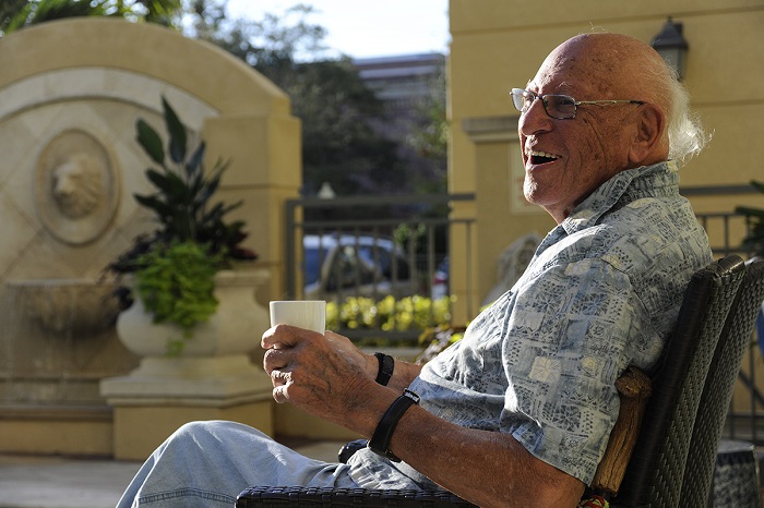 Senior gentlement relaxing outside in a lawn chair