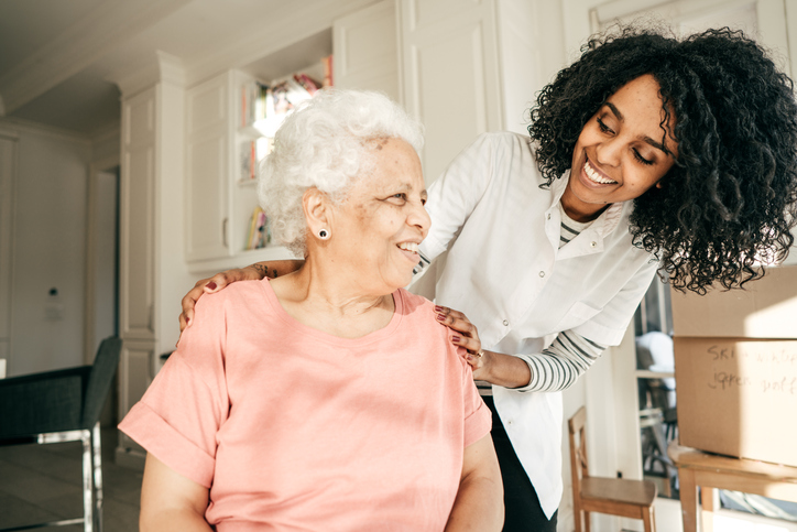 Woman care giver with a senior woman