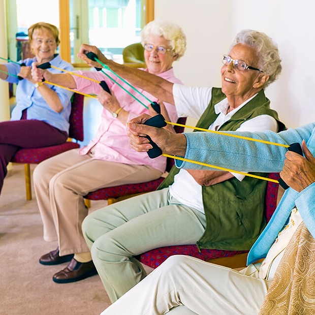 Group of people using stretch bands.