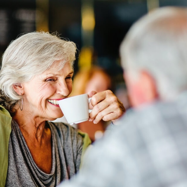 Man and woman drinking coffee together.