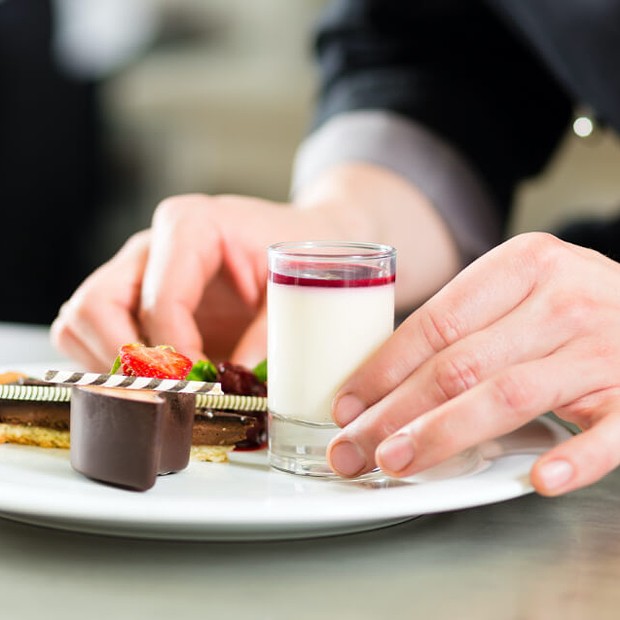 Chef serving dessert. 