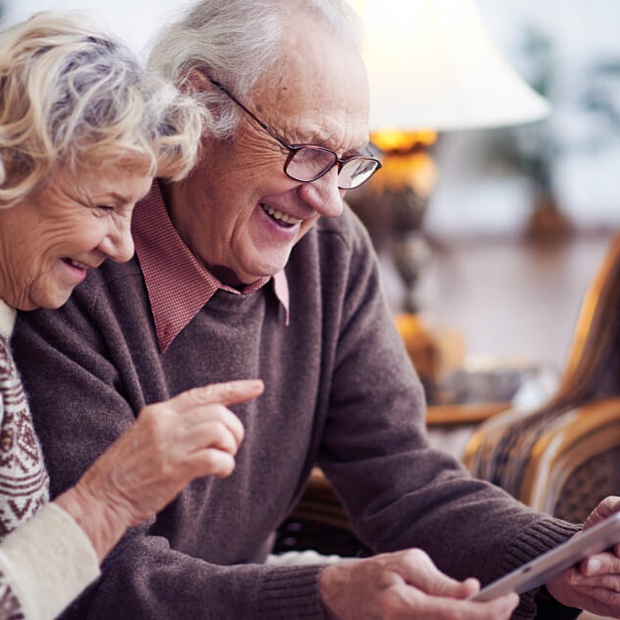 Elderly couple playing games at social hour.