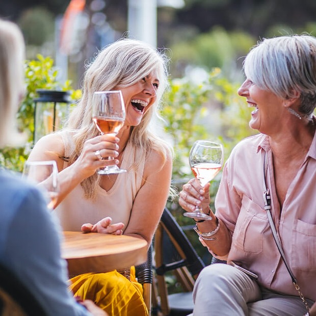 Women enjoying drinks. 