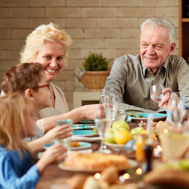 Family eating at table.