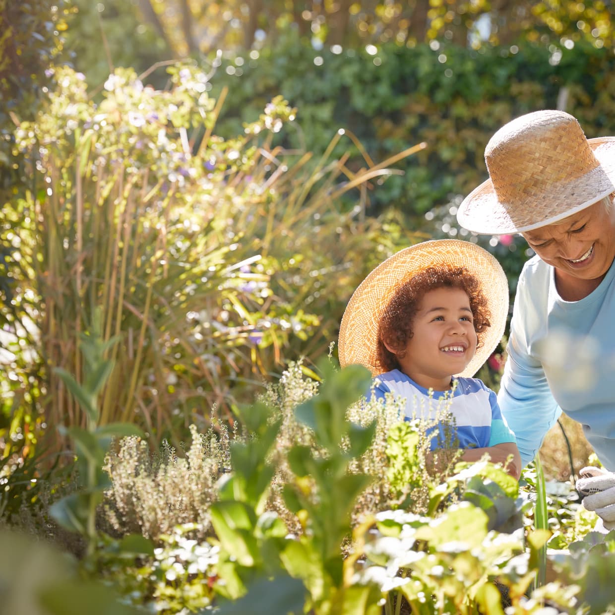 woman-with-grandson-in-garden