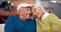 couple smiling and hugging