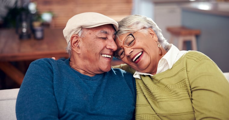 couple smiling and hugging