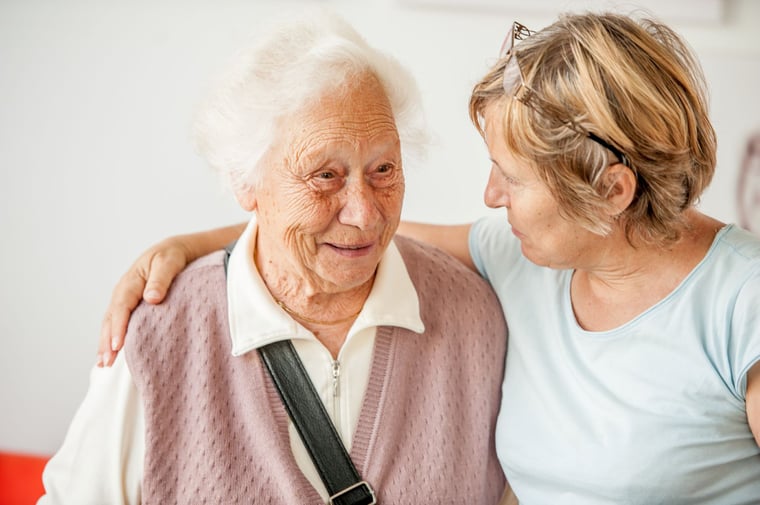 older female with Alzheimer's and a younger woman 