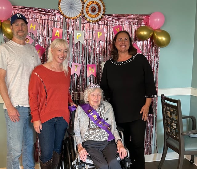 loretta sits surrounded by her family and mayor elizabeth davies