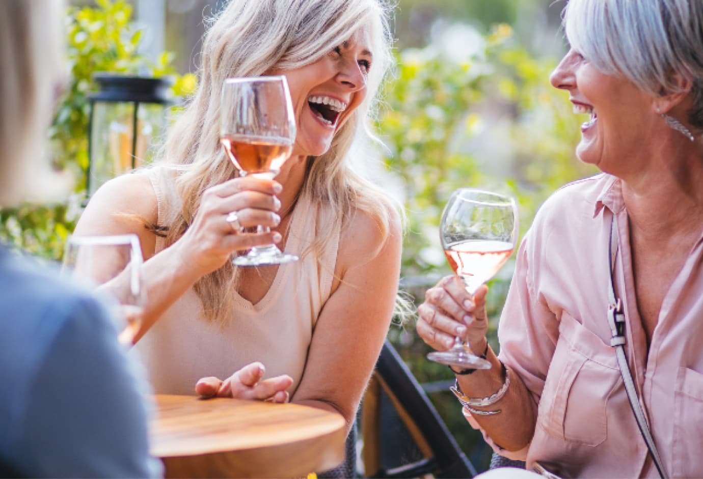 Women enjoying drinks with one another. 